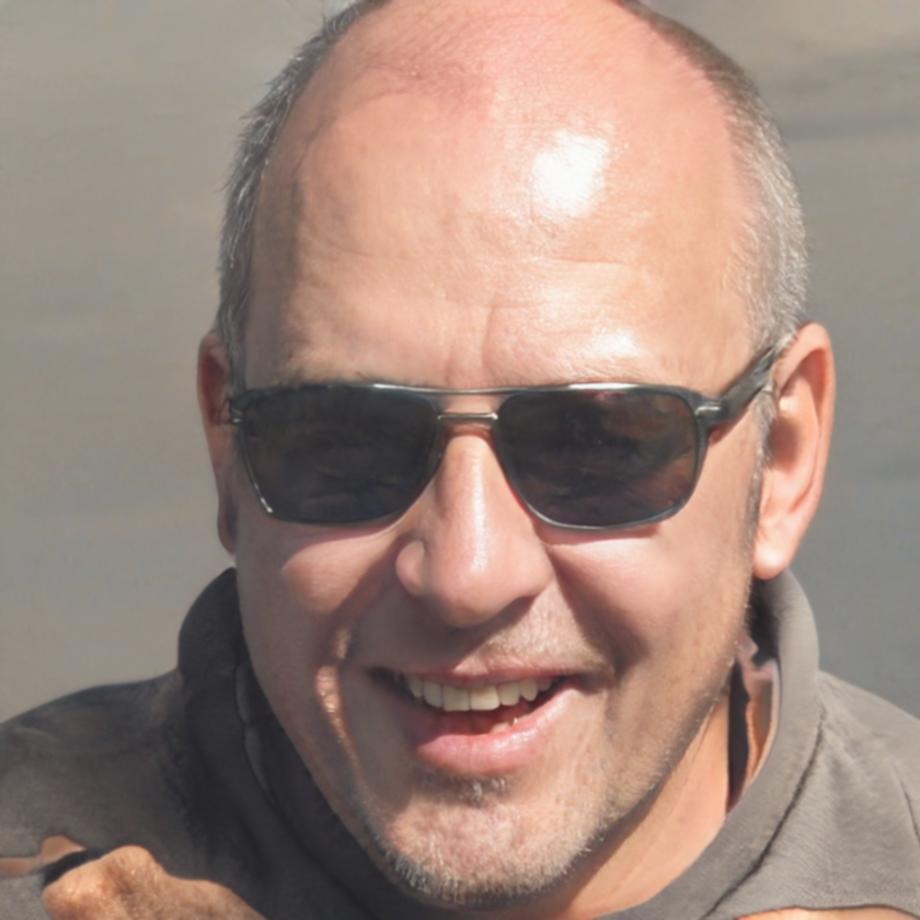 Professional headshot of male testing consultant